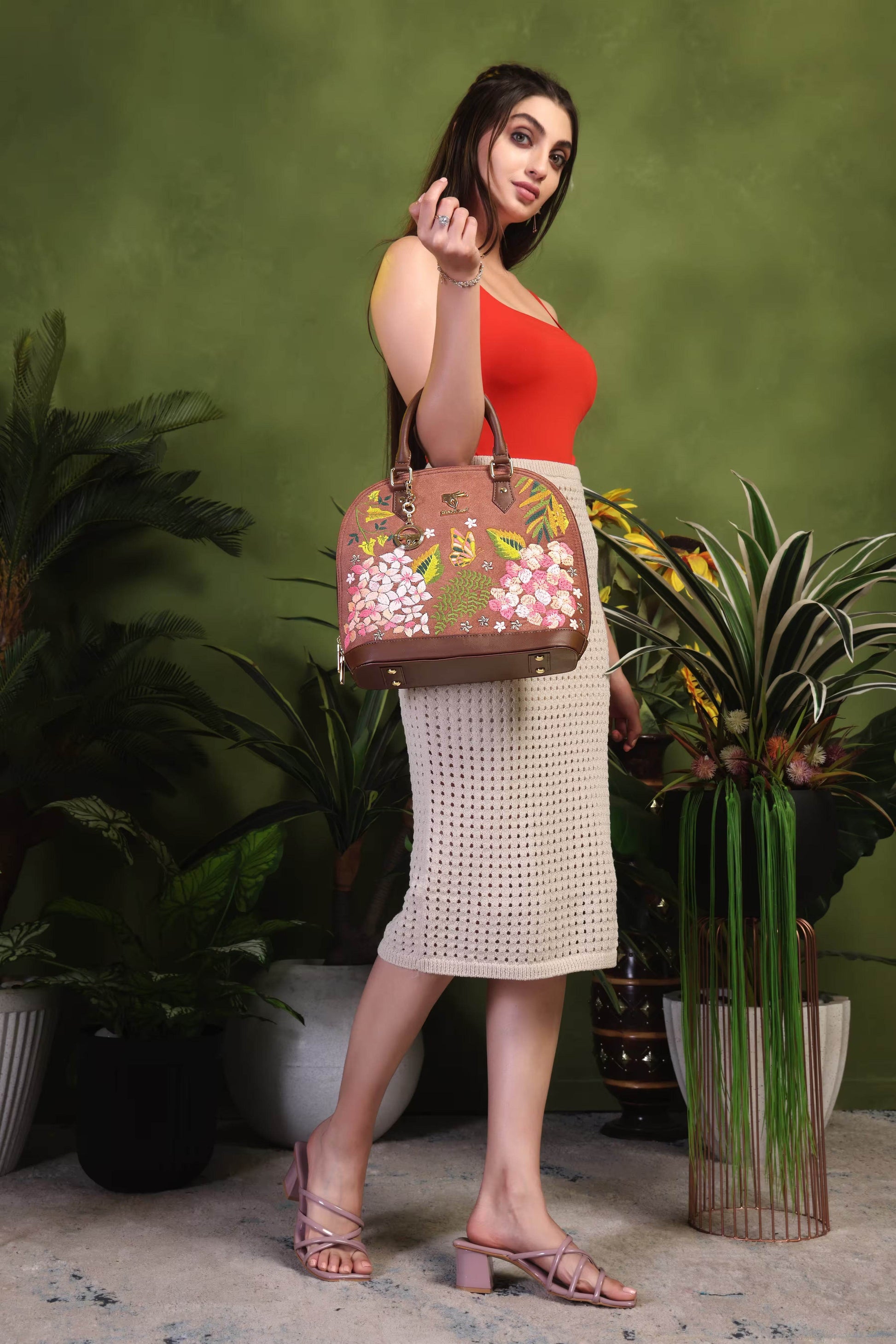 Brown floral vegan leather top handle bag from the Blossom Wood Collection placed on a clean background