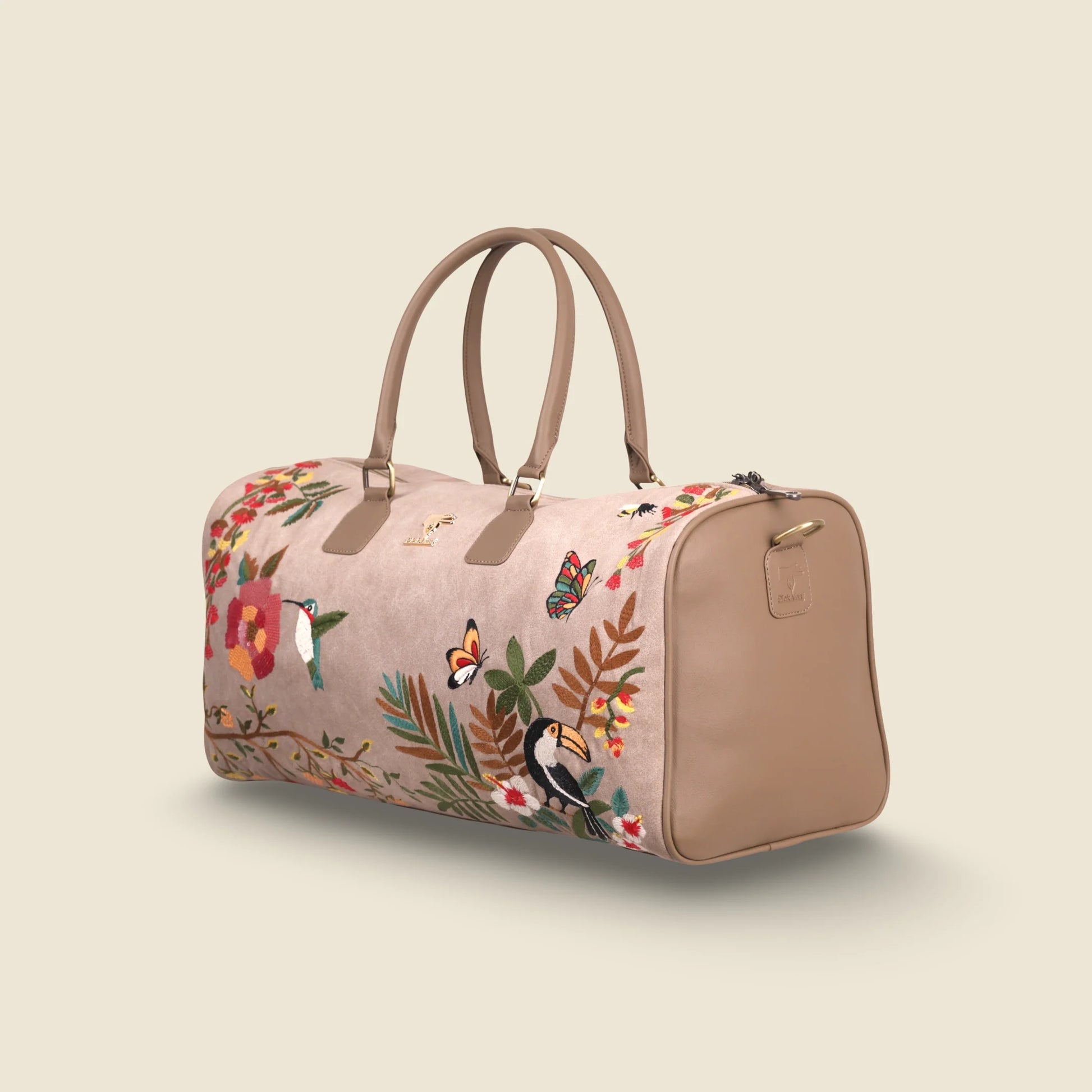 Beige travel duffel bag for women in cruelty free vegan leather by PickAleaf for cabin trips and refined luxury travel use
