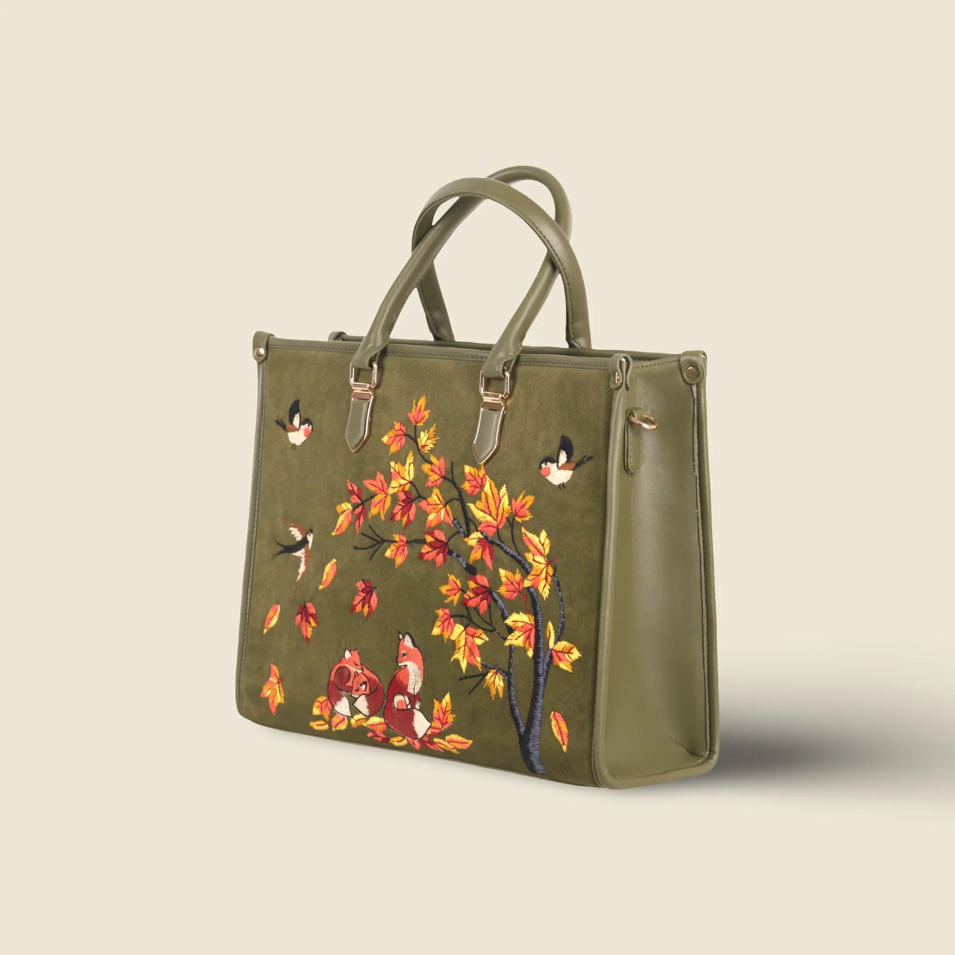 Olive green travel tote bag for women in cruelty free vegan leather by PickAleaf with embroidered design for travel and weekend use